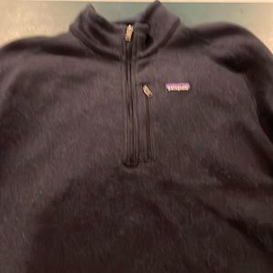 Patagonia 1/4 zip.   Fairly heavy and normal wear.   Great quality and comfy